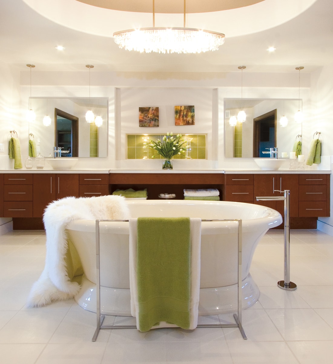 Warm wood vanity with stainless pulls and lime green and white accessories.