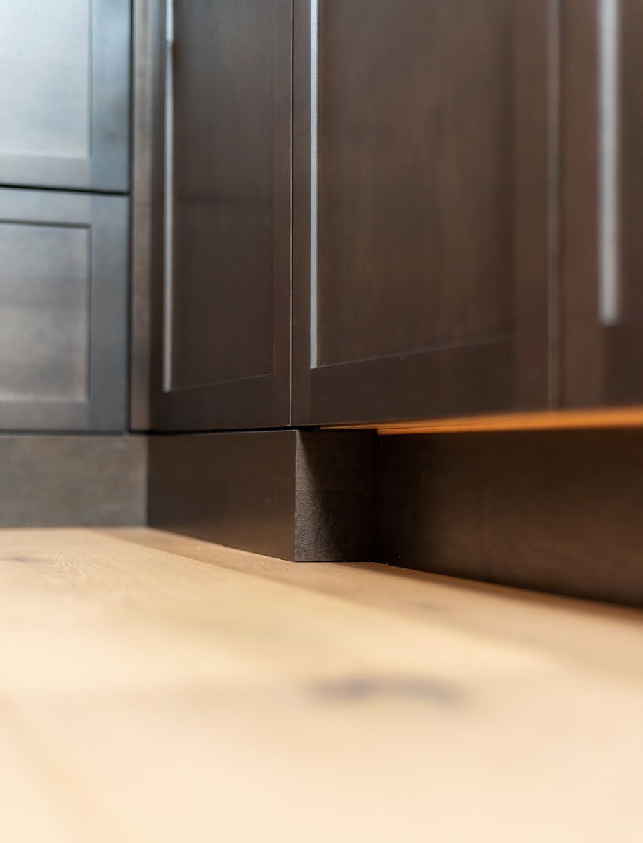 Perfectly aligned dark brown cabinet doors.