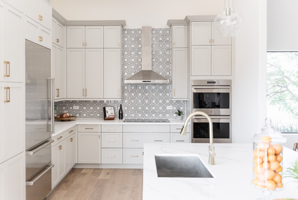 Tall white floor to ceiling cabinetry.